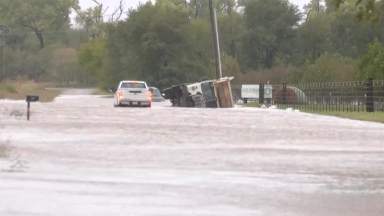 Trash truck overturns in floodwaters near El Reno, driver hospitalized ...
