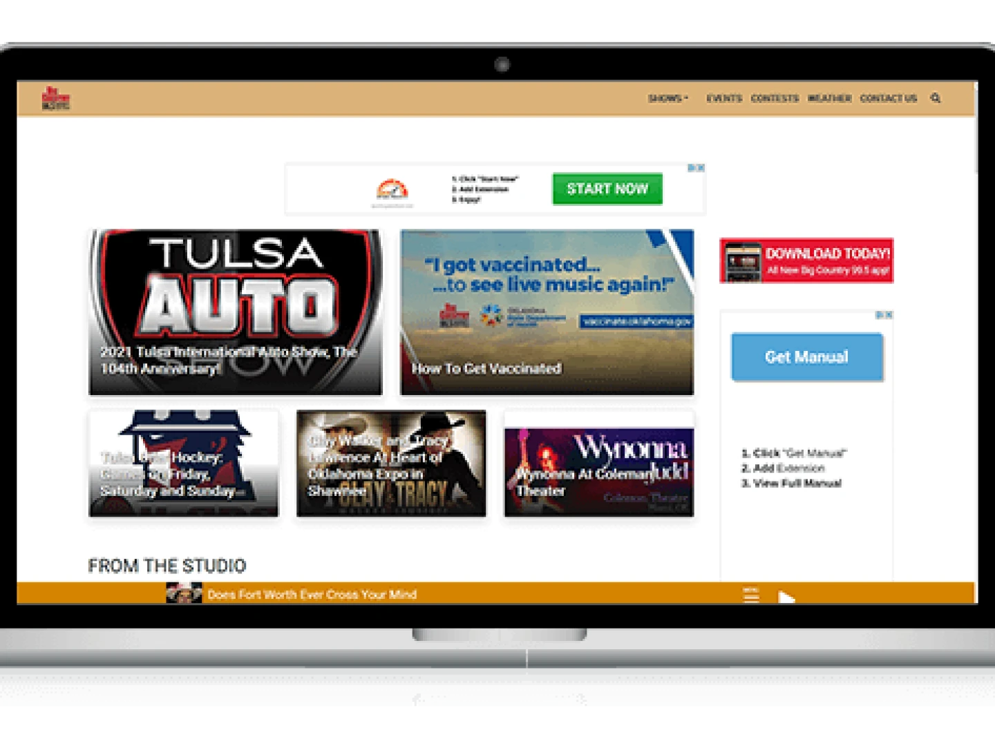 laptop showing bigcountry995.com homepage