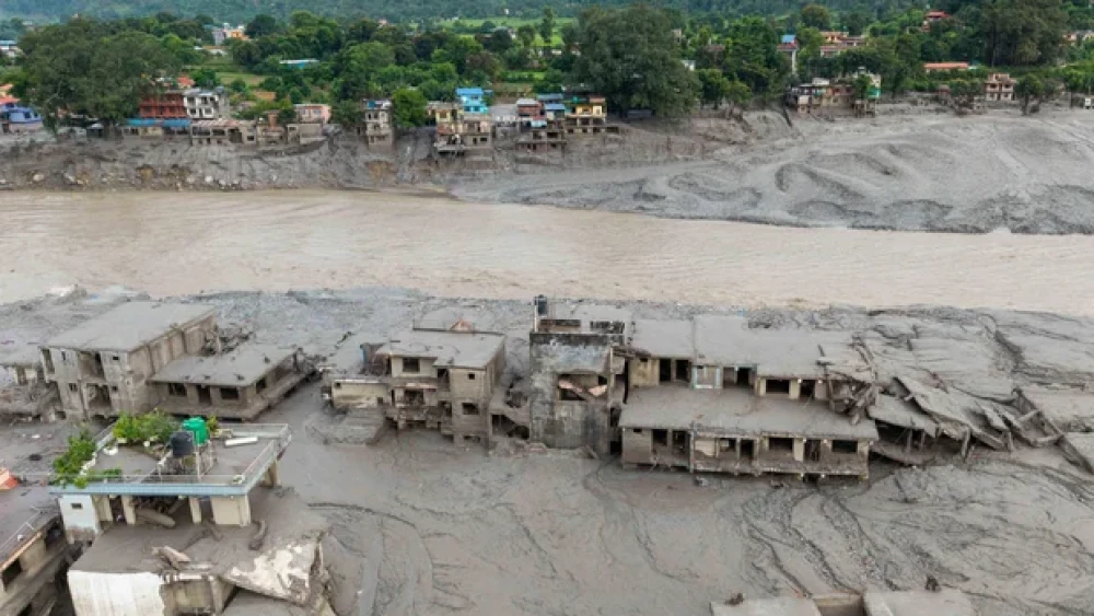 An aerial view shows houses covered in mud after flash floods at Devighat, Bidur Municipality in Nepal