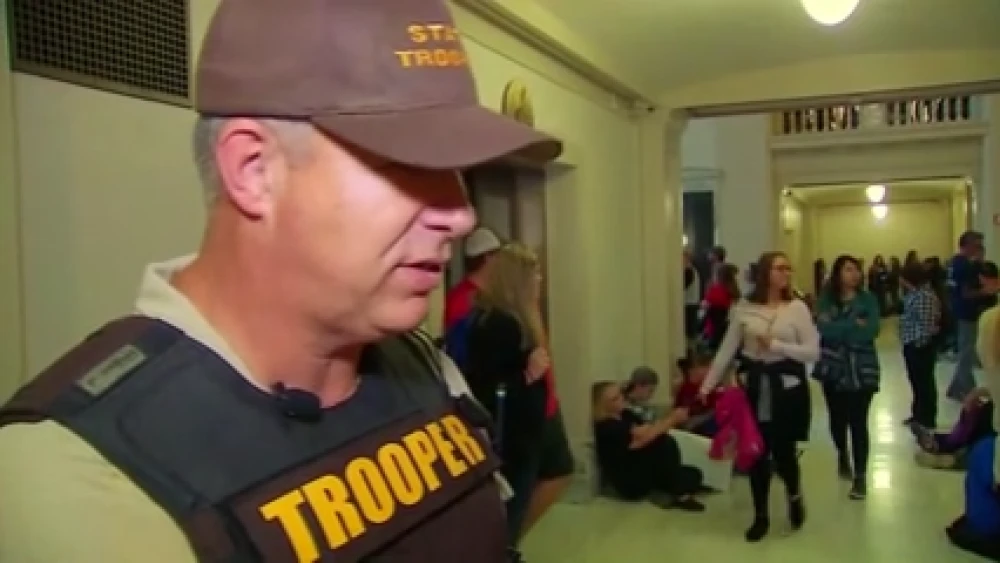 ICE Director nominee Lance Schroyer in 2018 wearing an Oklahoma state trooper uniform at the state capitol.