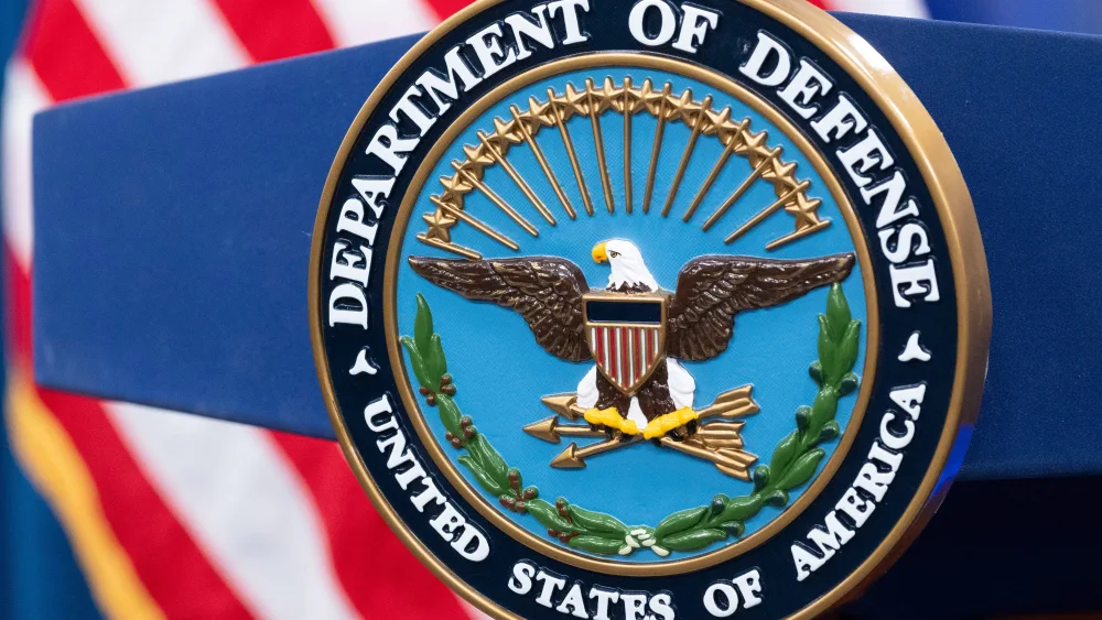 FILE - The Department of Defense seal is seen on the podium in the Press Briefing room at the Pentagon on Oct. 29, 2024, in Washington. (AP Photo/Kevin Wolf, File)