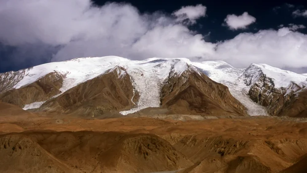 Glaciers are seen in the Pamir Mountains, a range in Central Asia formed by the junction of the Himalayas, Tian Shan, Karakoram, Kunlun and Hindu Kush mountain ranges, as seen in a file photo taken from the Karakoram Highway, in Xinjiang, China.